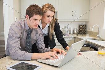 Couple watching something on the laptop