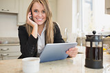 Smiling woman with tablet and mobile phone
