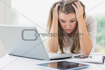 Stressed businesswoman getting headache
