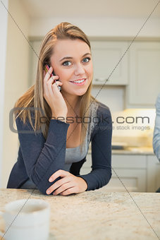Cheerful woman phoning