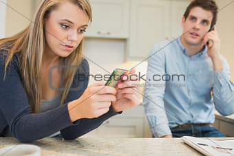 Man calling while woman texting