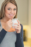 Woman warming up with a hot beverage