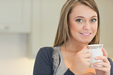 Happy woman drinking coffee