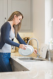 Woman doing the washing up