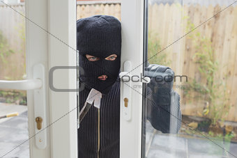 Burglar opening the door