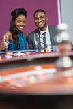 Couple sitting at roulette table