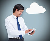 Businessman using a tablet pc with cloud computing symbol