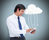 Businessman holding a tablet pc connecting with cloud computing