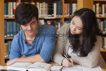 Two concentrated students learning