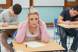 Stressed student sitting in a classroom