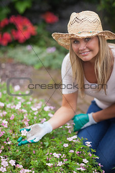 Woman gardening and touching flower