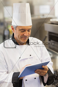 Chef touching his digital tablet