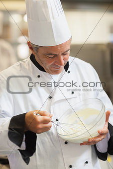 Chef whisking cream