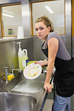 Woman washing the dishes