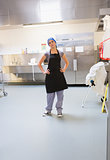 Cleaning woman standing in kitchen