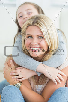 Daughter hugging mother