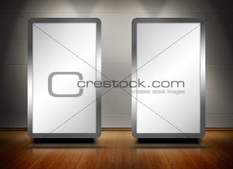 Two blank screens standing on wooden floor