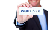 Businessman holding a label with web design written on it