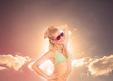 Blonde woman enjoying sunbathing in bikini
