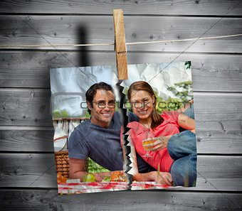 Ripped photo of couple hung with a peg