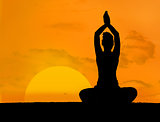Calm silhouette of woman doing yoga