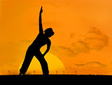 Calm silhouette of woman practicing yoga