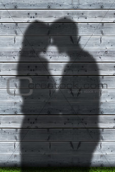 Shadows of couple embracing