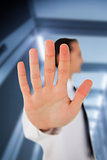 Businessman placing his hand on clear surface