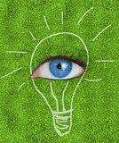 Blue eye surrounded by a drawing of a light bulb