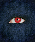 Red eye over blue texture