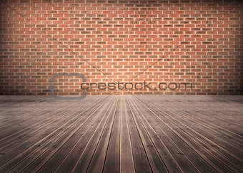 Room of floorboards with bricks wall
