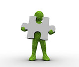 Green character holding a jigsaw piece