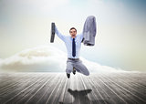 Stressed businessman jumping over wooden boards