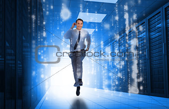 Businessman running through data center