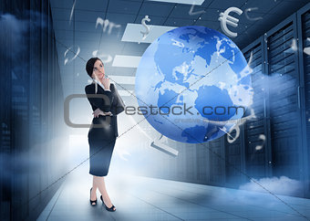 Businesswoman standing in data center with earth and currency graphics