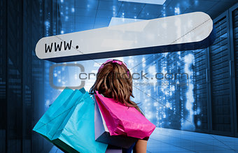 Girl holding shopping bags looking at address bar
