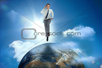 Businessman racing on top of the world