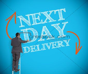 Businessman writing next day delivery on a wall