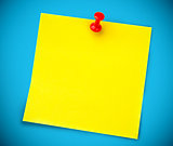 Yellow post it on the wall