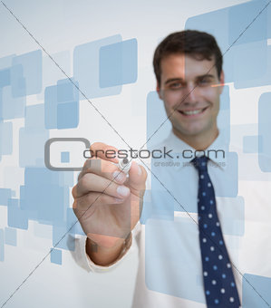 Smiling businessman about to write something