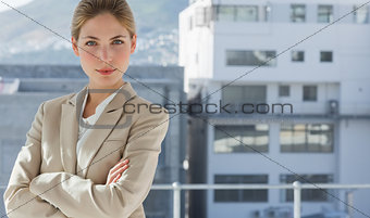 Businesswoman with arms folded in her office