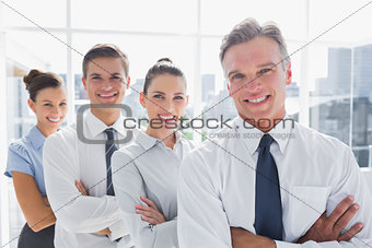 Smiling business people standing together in line