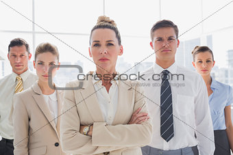 Group of serious business team standing together