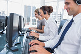 Group of call center agents working in line