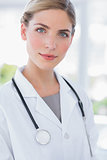 Blond woman doctor standing