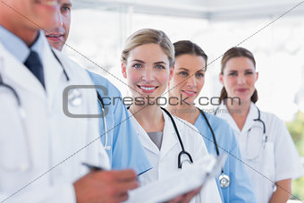 Smiling medical team in row