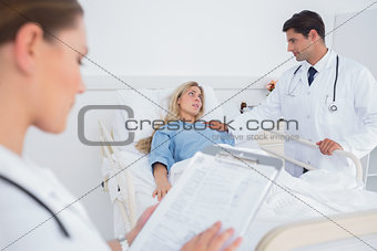 Attractive doctor taking care of a patient