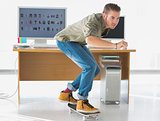 Handsome employee skating through the office