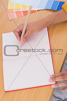 Woman drawing on a paper
