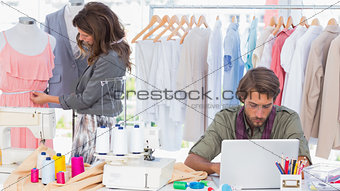 Fashion designers working in a bright office